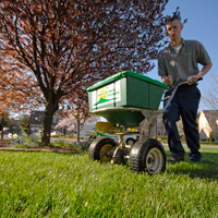 Technician using spreader